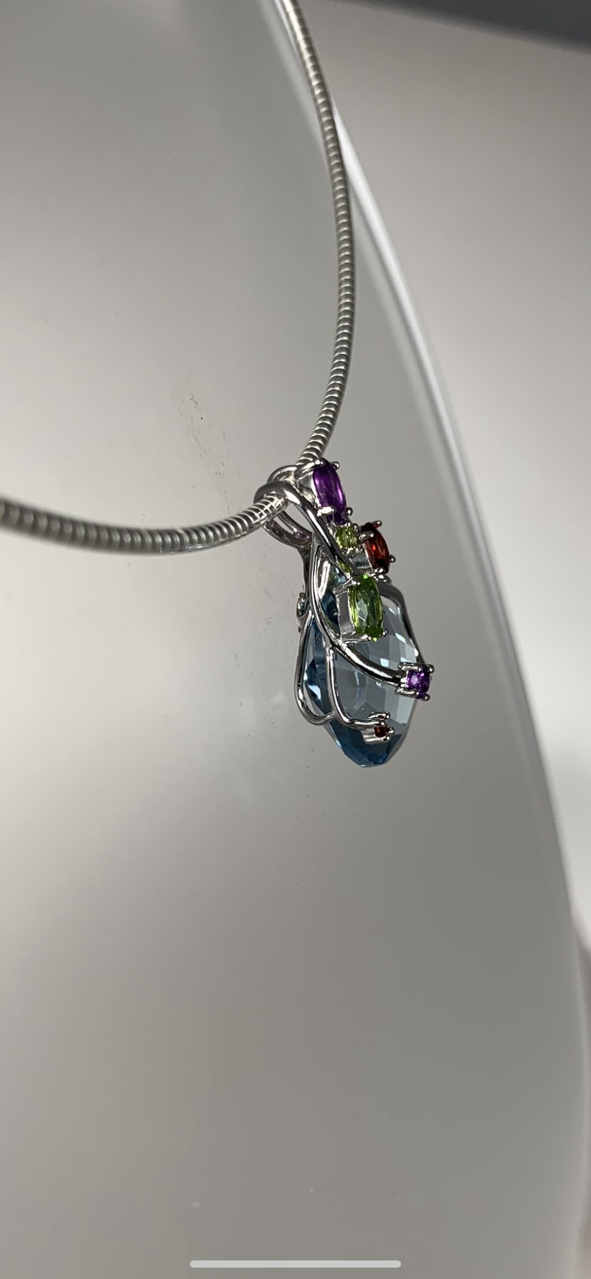 Sterling Silver and Oval Light Blue Crystal and Genuine Gems Pendant