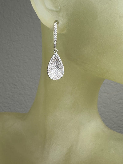 Silver Tone Concave Tear Shape Dangling Earrings with Pave Set Cubic Zirconia