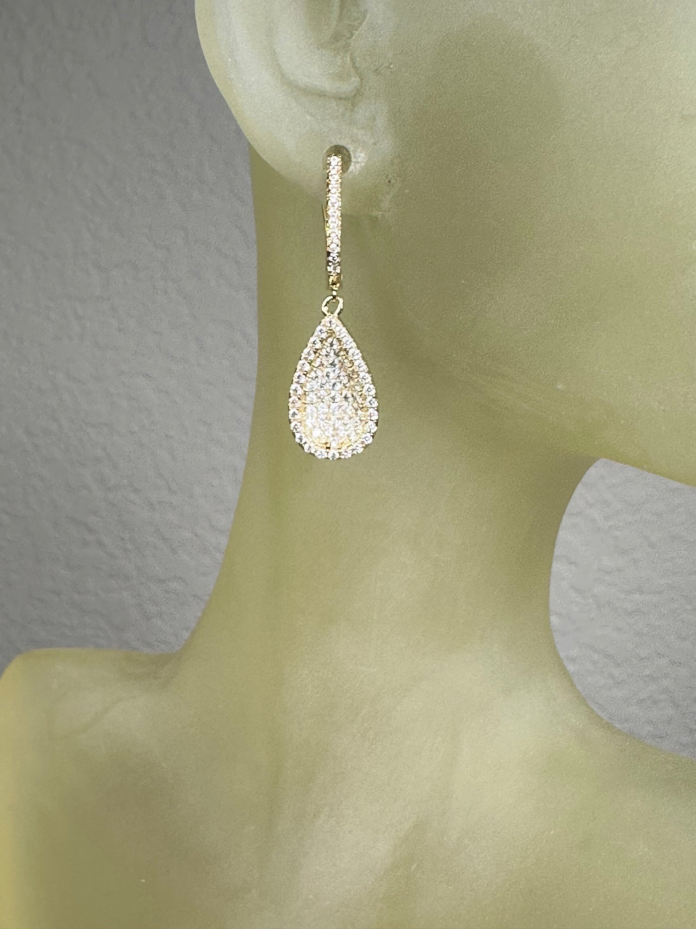 Yellow Gold Tone Concave Tear Shape Dangling Earrings with Pave Set Cubic Zirconia