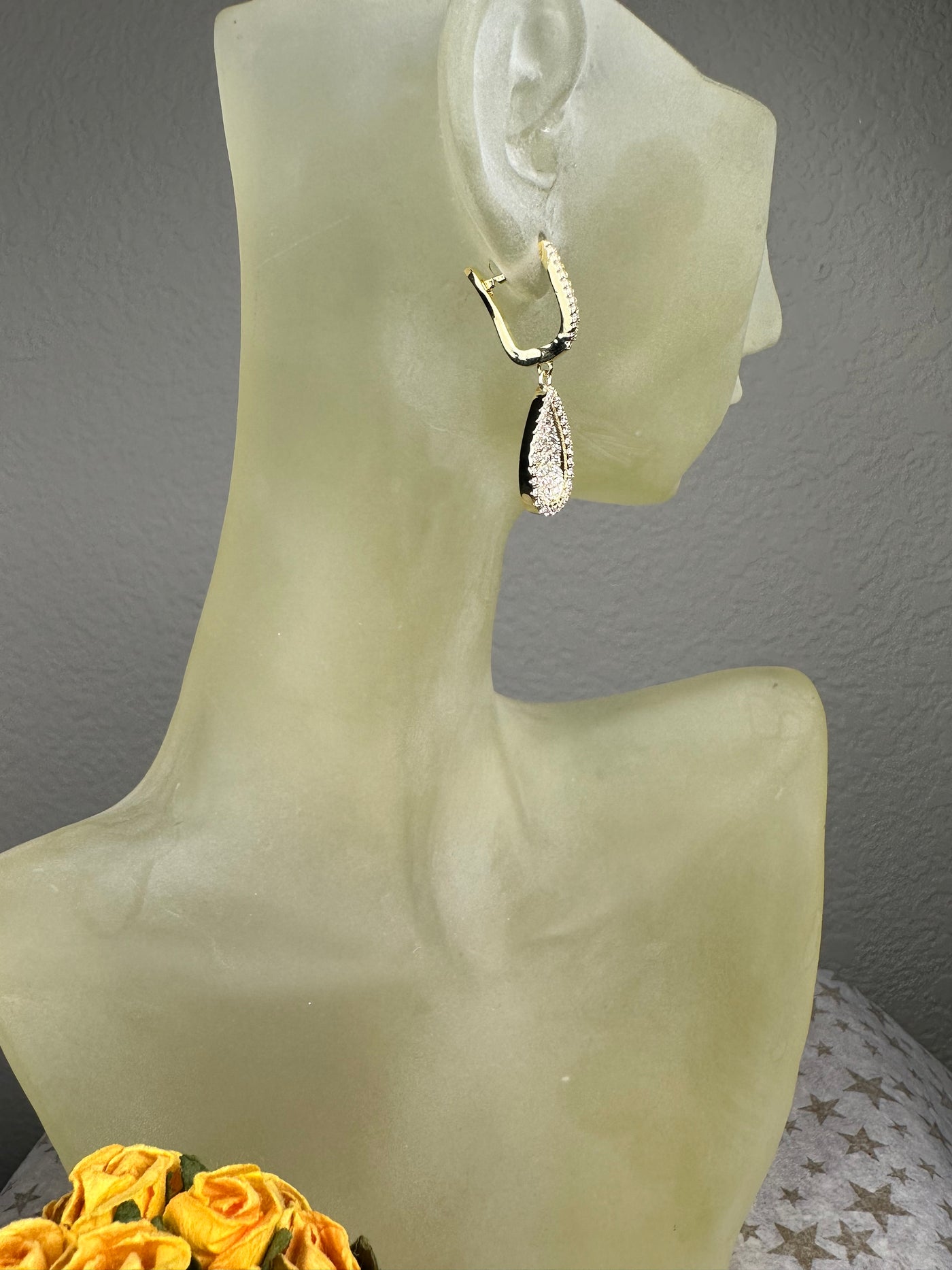 Yellow Gold Tone Concave Tear Shape Dangling Earrings with Pave Set Cubic Zirconia
