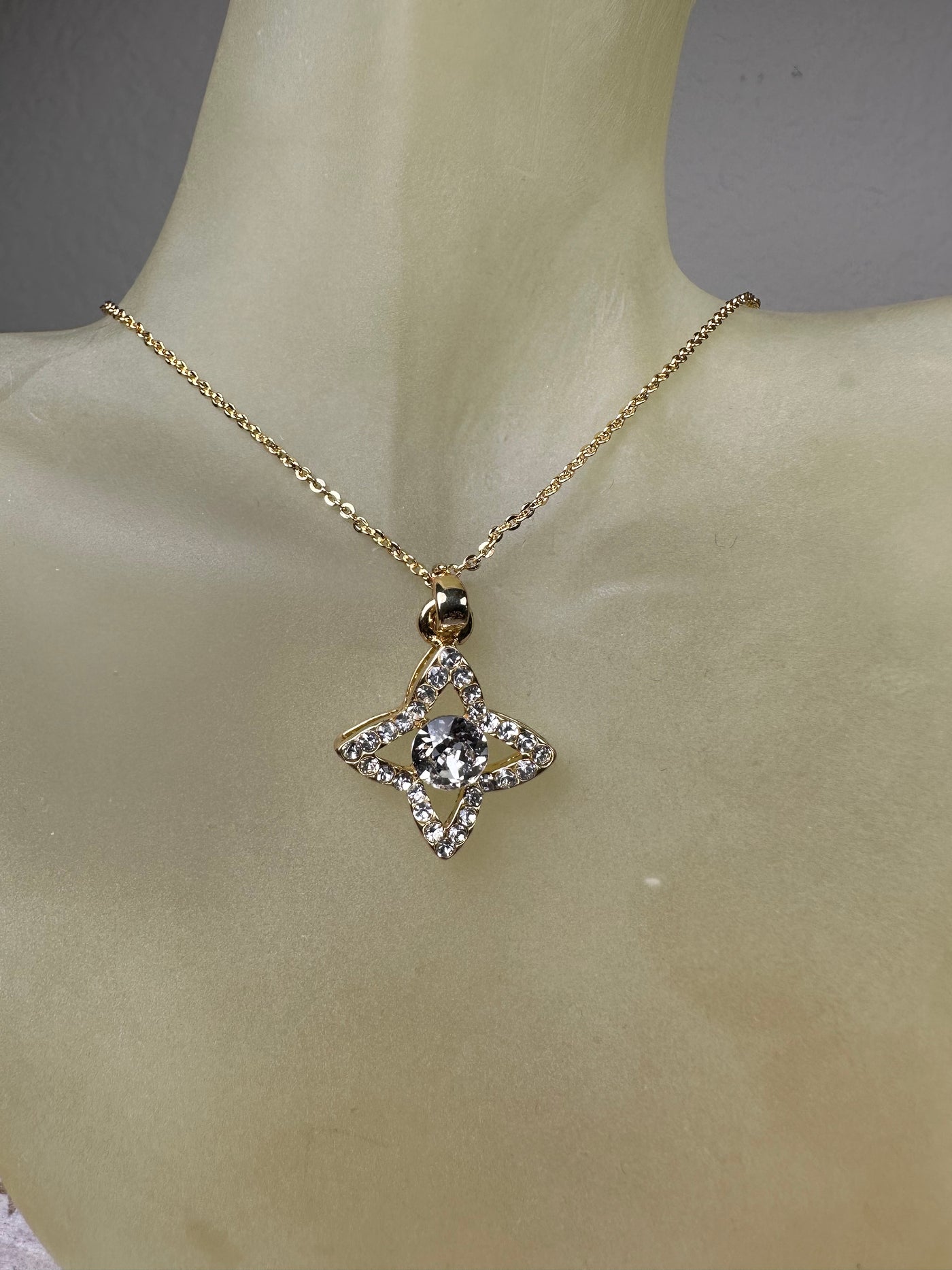 Yellow Gold Tone Four Pointed Crystal Pendant Necklace