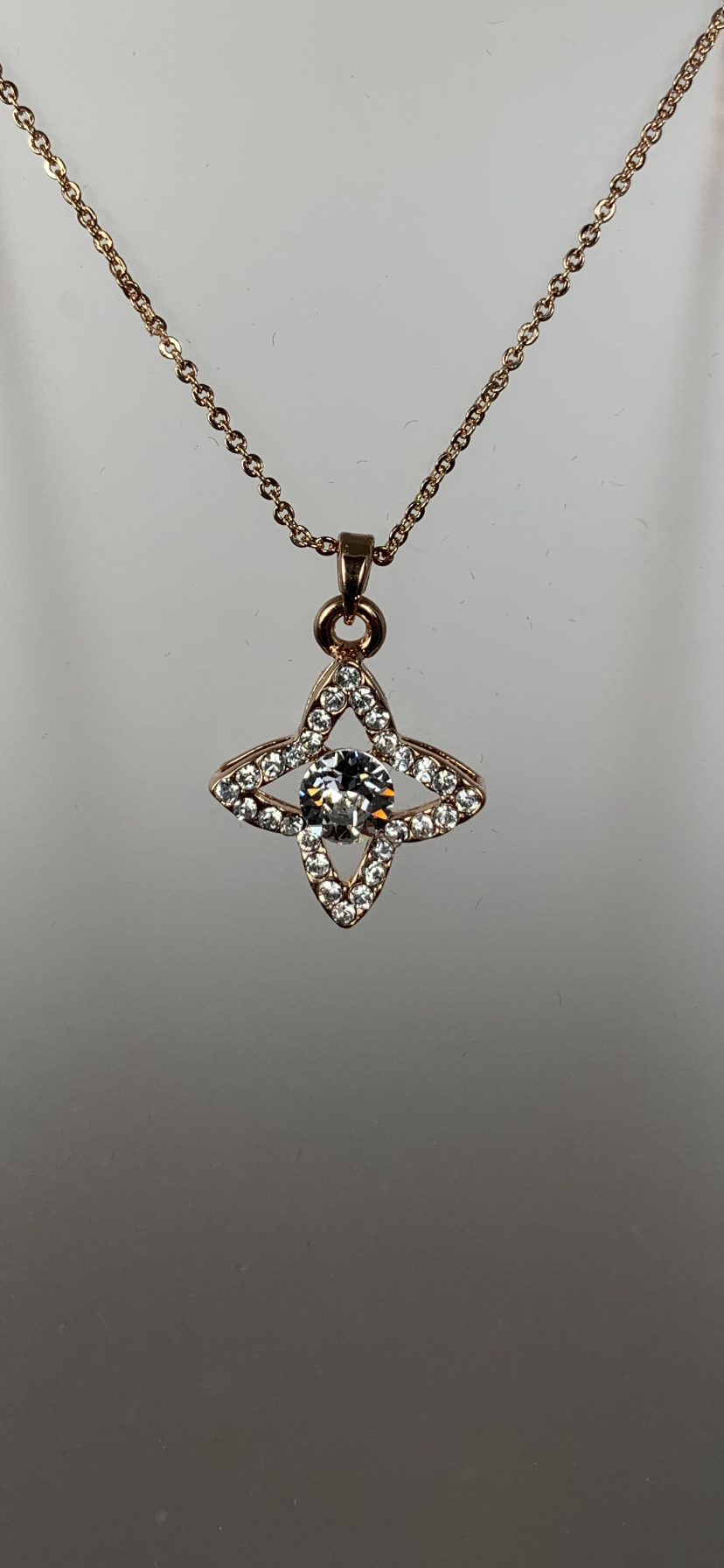 Rose Gold Tone Four Pointed Crystal Pendant Necklace