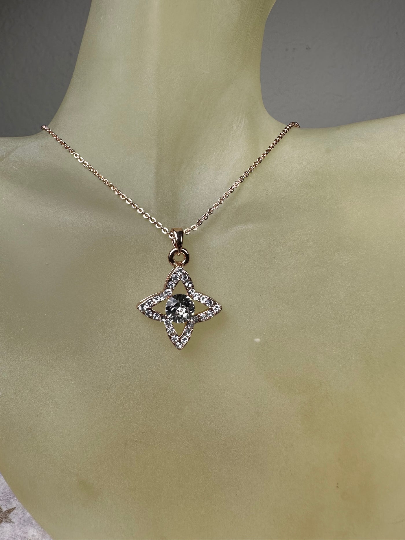 Rose Gold Tone Four Pointed Crystal Pendant Necklace