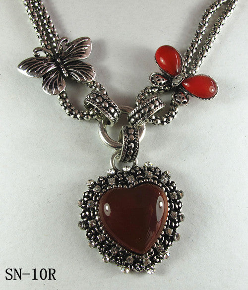 Silver Tone Necklace Featuring a Howlite Red Agate Heart Pendant
