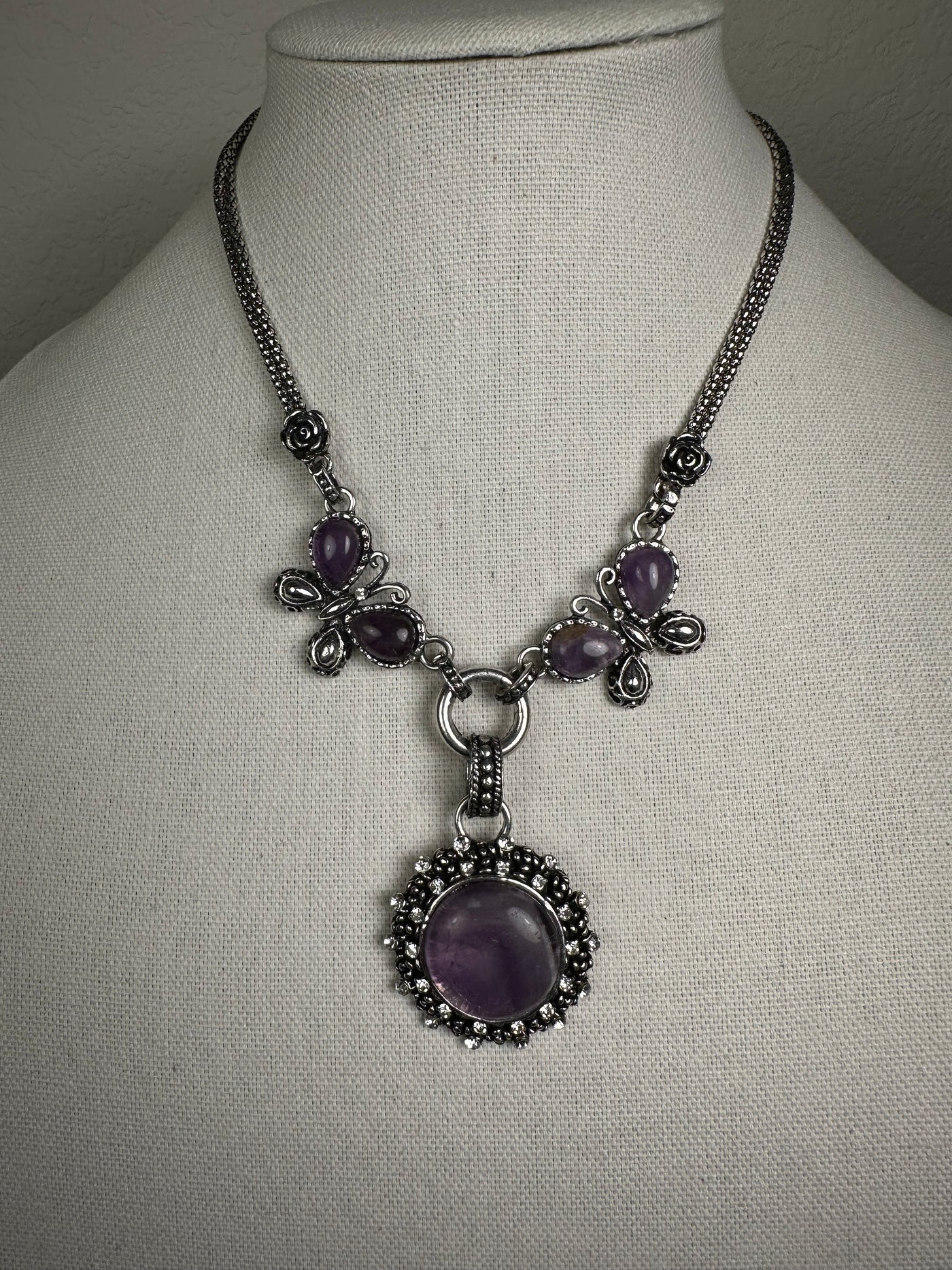 Silver Tone Ornate Necklace Decorated with Round Amethyst and Crystals