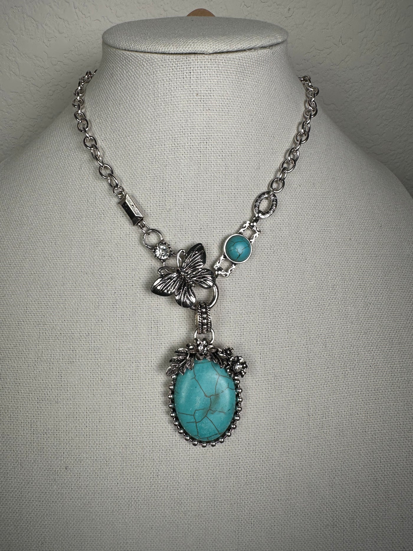 Silver Tone Necklace with an Ornate Oval Blue Turquoise Howlite Drop
