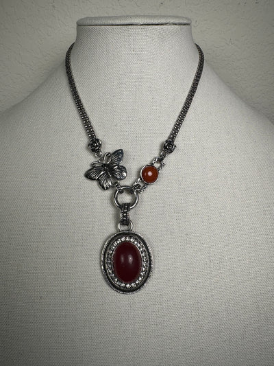 Silver Tone Necklace with an Oval Howlite Red Carnelian Drop