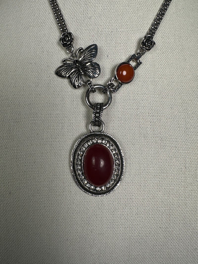 Silver Tone Necklace with an Oval Howlite Red Carnelian Drop