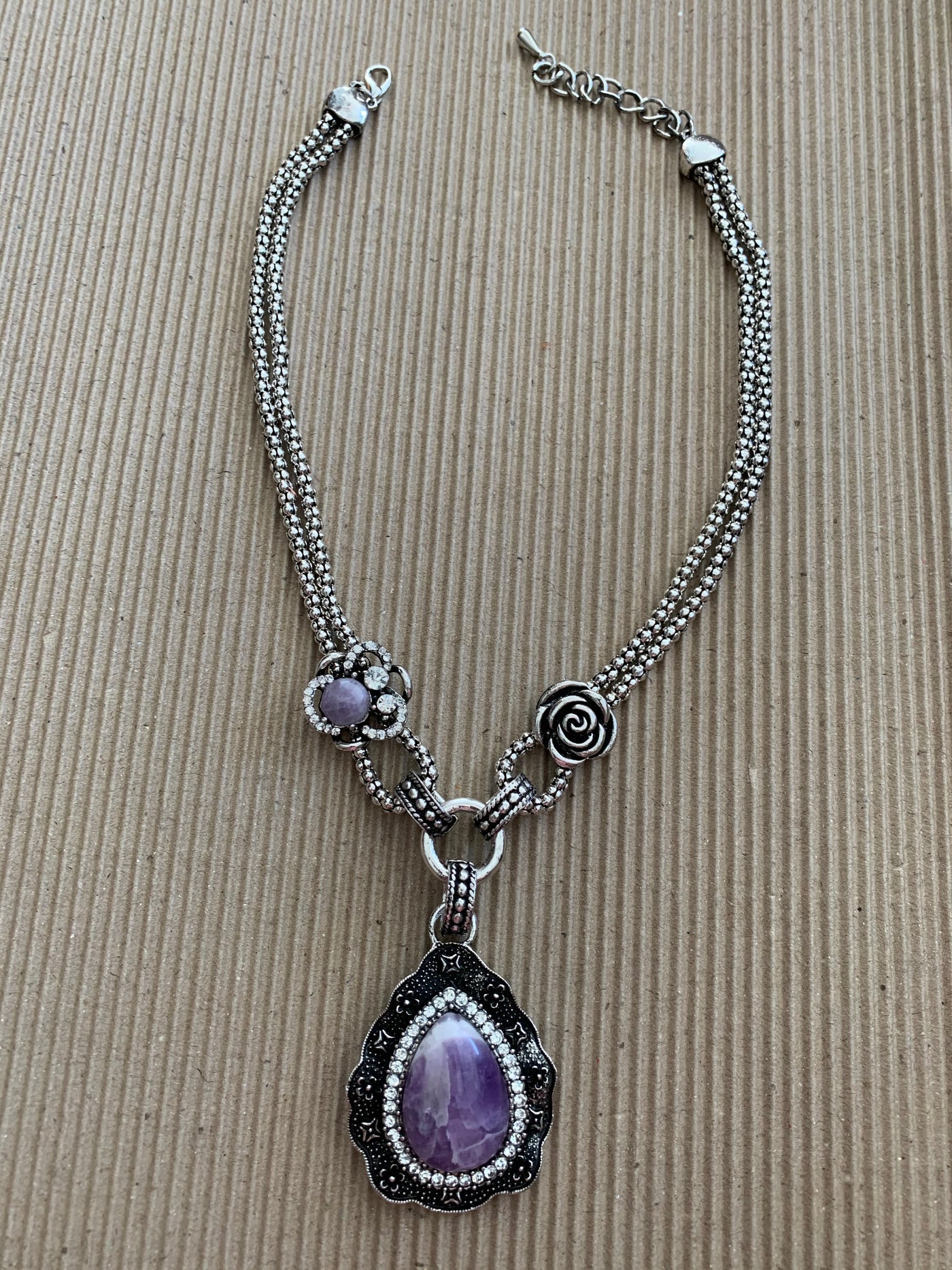 Silver Tone Necklace Featuring a Howlite Amethyst Pendant