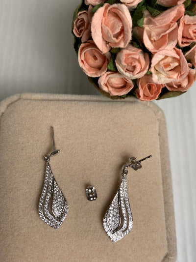 Silver Tone Dangling Earrings Decorated with Pave Set Cubic Zirconia