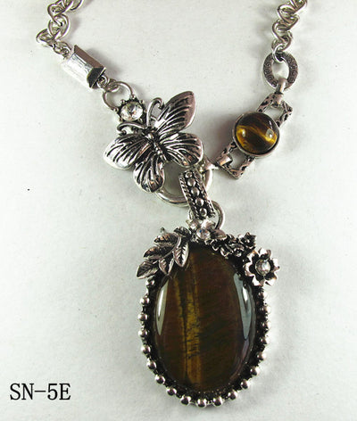 Silver Tone Necklace with an Ornate Oval Howlite Tiger Eye Drop