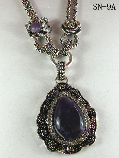 Silver Tone Necklace Featuring a Howlite Amethyst Pendant