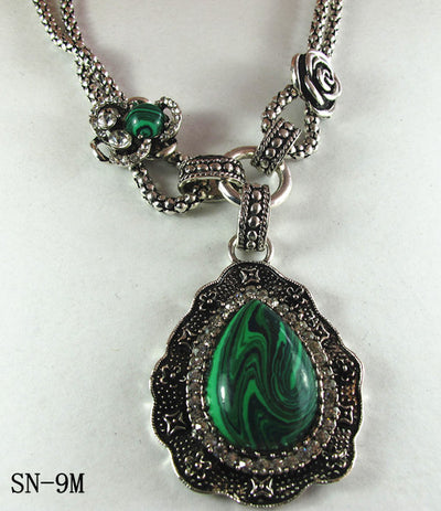 Silver Tone Necklace Featuring an Ornate Malachite Howlite Drop