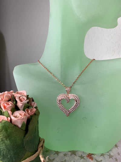 Cut Out Heart Pendant Decorated with Pave Set Cubic Zirconia