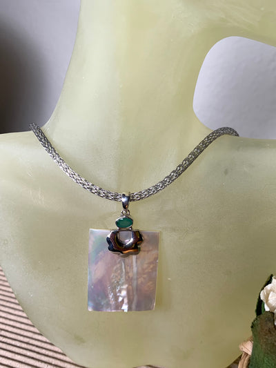 Natural White Shell Pendant with Green Stone Accent in Sterling Silver