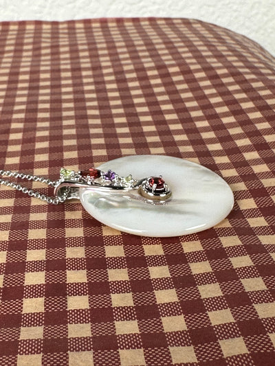 White Shell Pendant Enhanced with Garnet Peridot in Sterling Silver