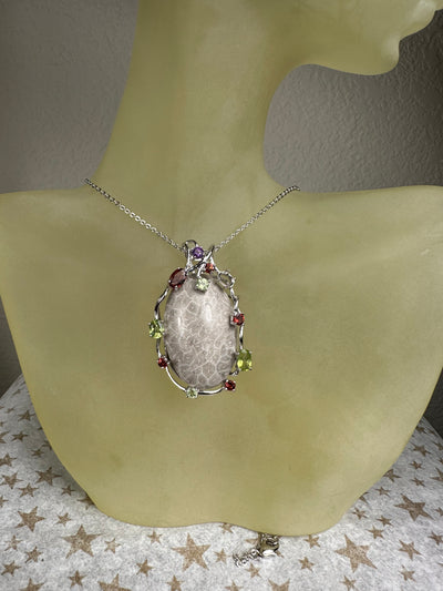Sterling Silver and Genuine Oval Coral Fossil Pendant with Gems Accent