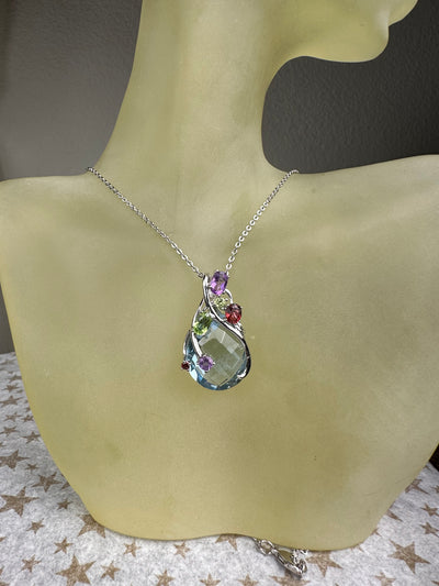 Sterling Silver and Oval Light Blue Crystal and Genuine Gems Pendant