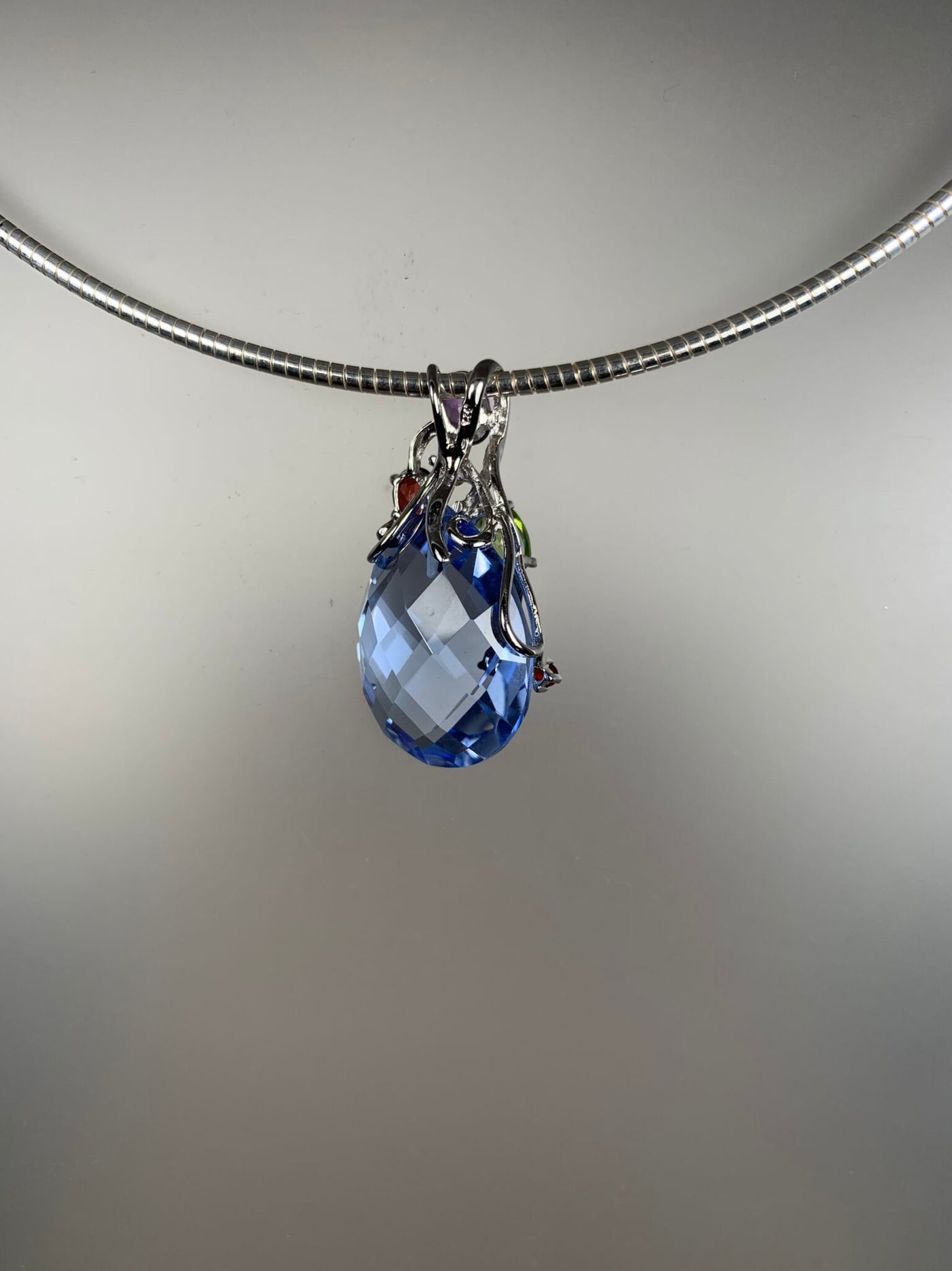 Sterling Silver and Oval Medium Blue Crystal and Genuine Gems Pendant