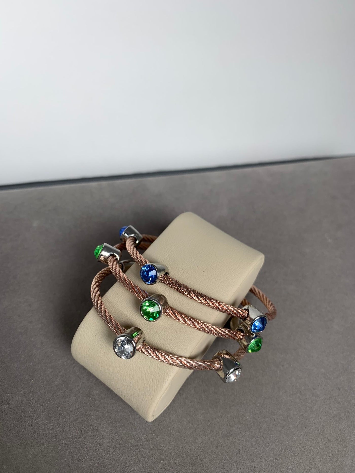 Rose Gold Tone Wire Bracelet Featuring 3 blue Crystals