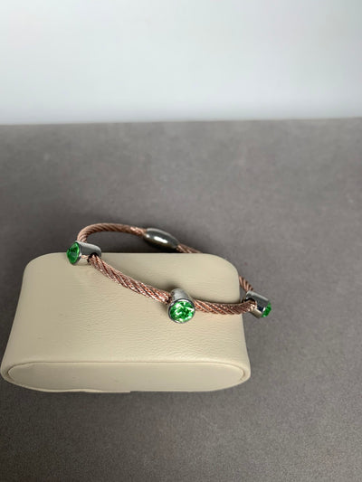 Rose Gold Tone Wire Bracelet Featuring 3 green Crystals