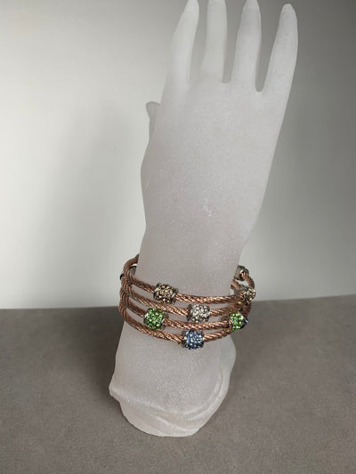 Rose Gold Tone Wire Bangle Bracelet Features 3 Encrusted Green Crystal Barrels