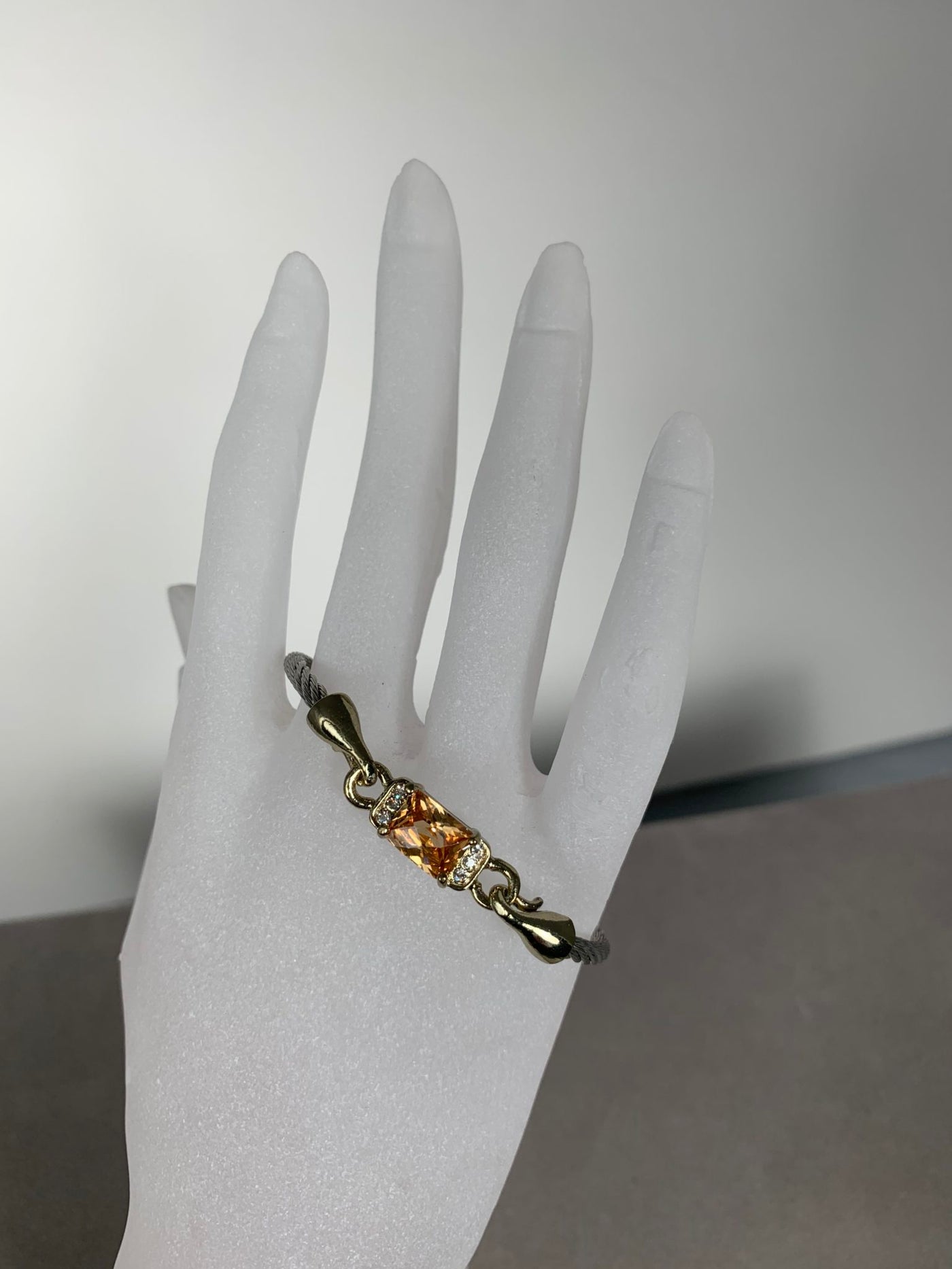 Silver Tone Wire Bangle Bracelet featuring Amber Yellow Crystal