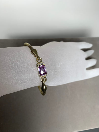 Yellow Gold Tone Wire Bangle Bracelet featuring Purple Crystal