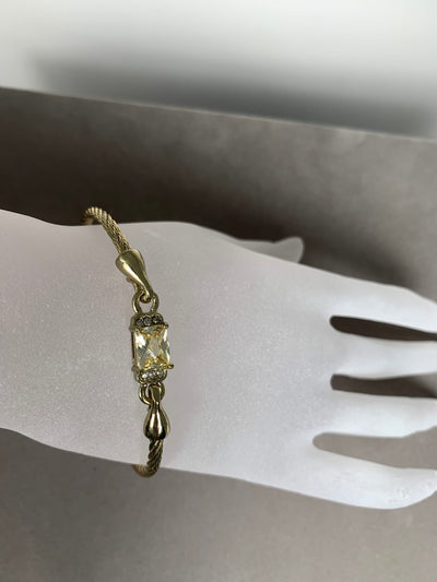 Yellow Gold Tone Wire Bangle Bracelet featuring Yellow Color Crystal