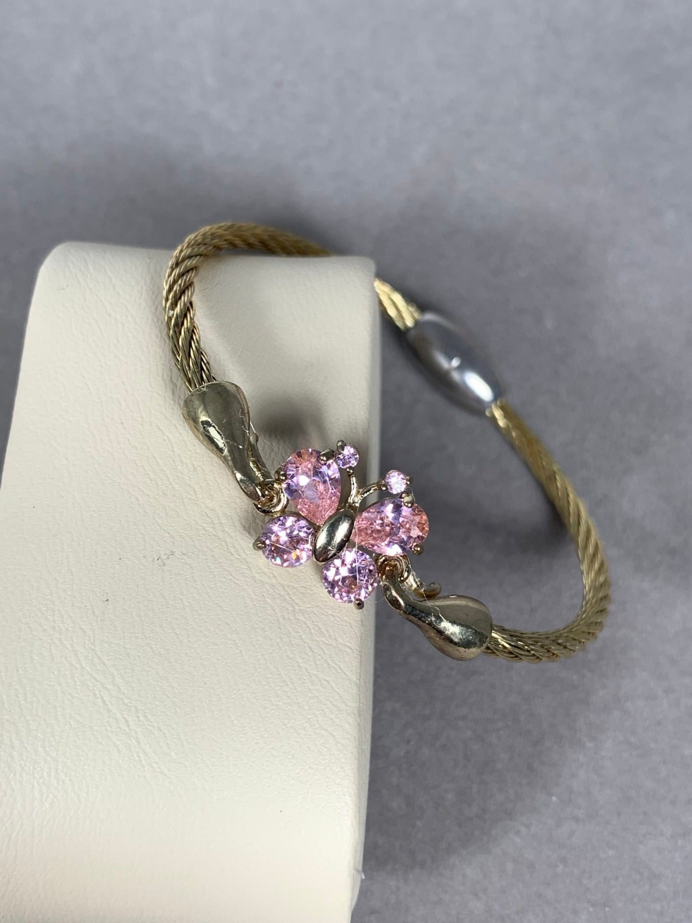 Gold Tone Wire Bangle Bracelet featuring Pink Crystal Butterfly