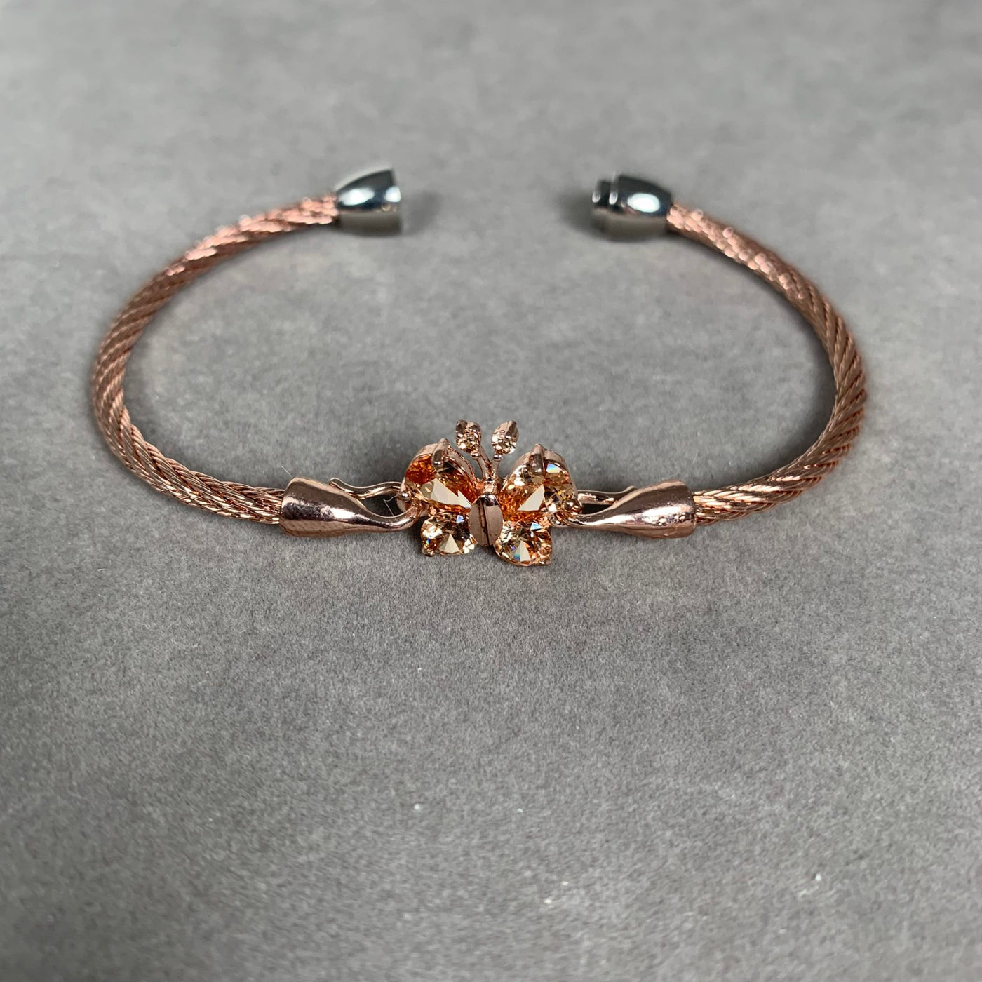 Rose Gold Tone Wire Bangle Bracelet featuring Chamagne Yellow Crystal Butterfly