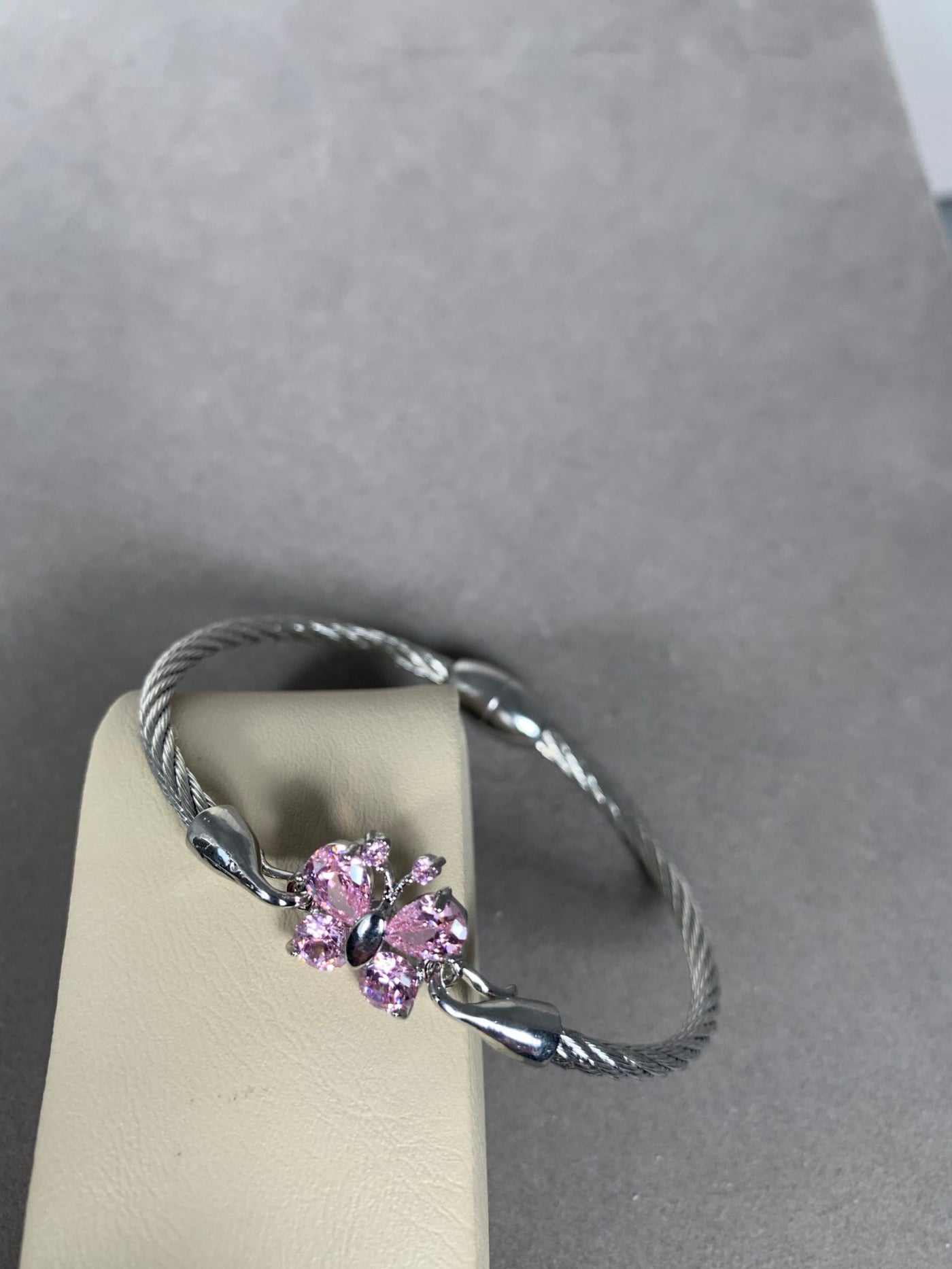 Silver Tone Wire Bangle Bracelet featuring Pink Crystal Butterfly