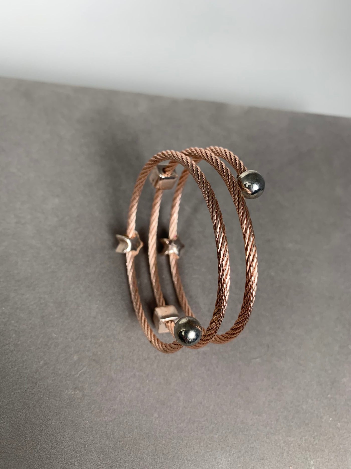 Rose Gold Tone Spiral Wire Bangle Bracelet with Pink Crystal Motifs
