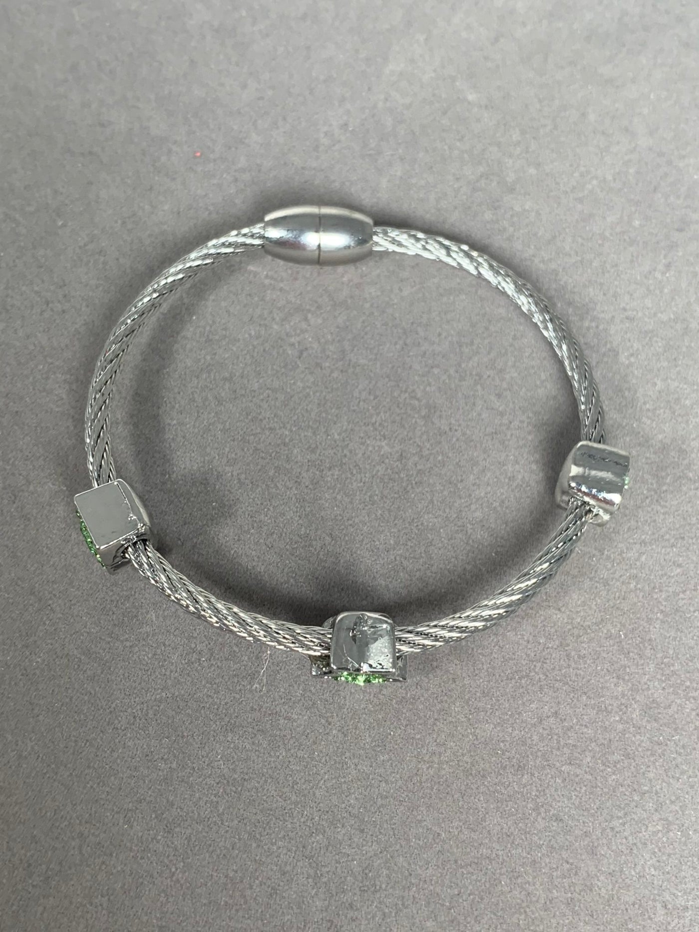 Silver Tone Wire Bangle Bracelet with 3 Green Crystal Heart Motifs