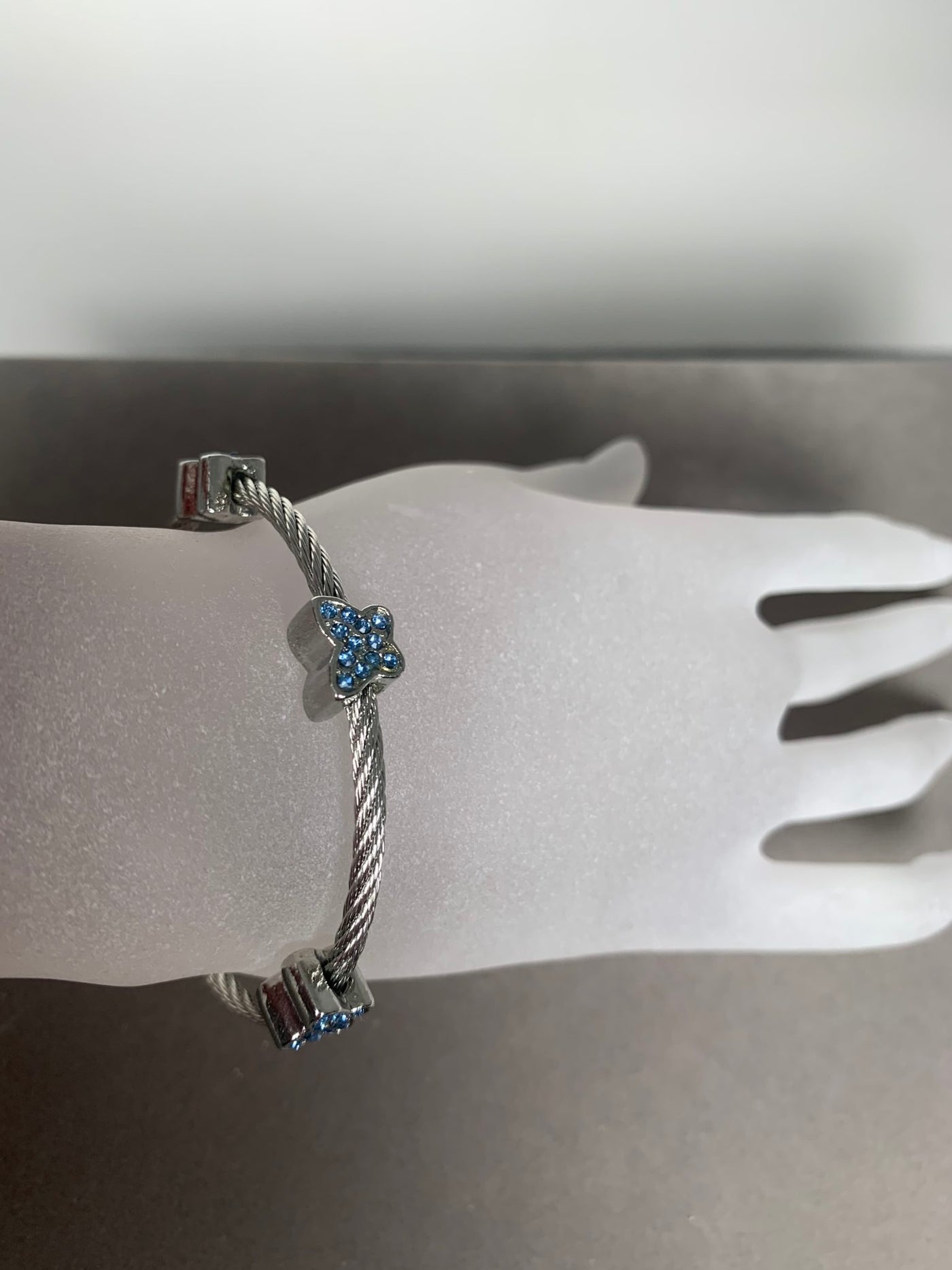 Silver Tone Wire Bangle Bracelet with 3 Blue Pave Crystal Motifs