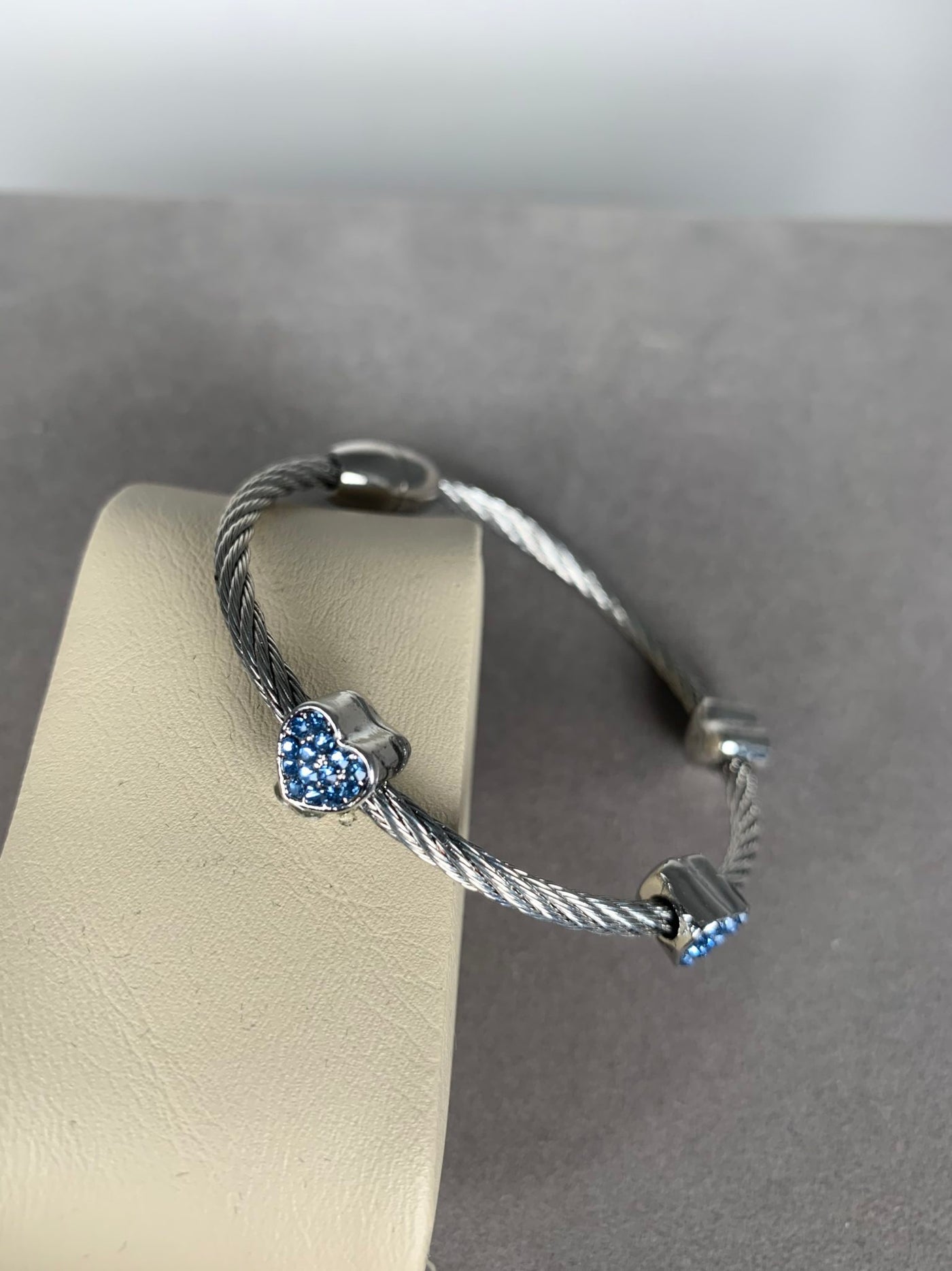 Silver Tone Wire Bangle Bracelet with 3 Blue Crystal Heart Motifs