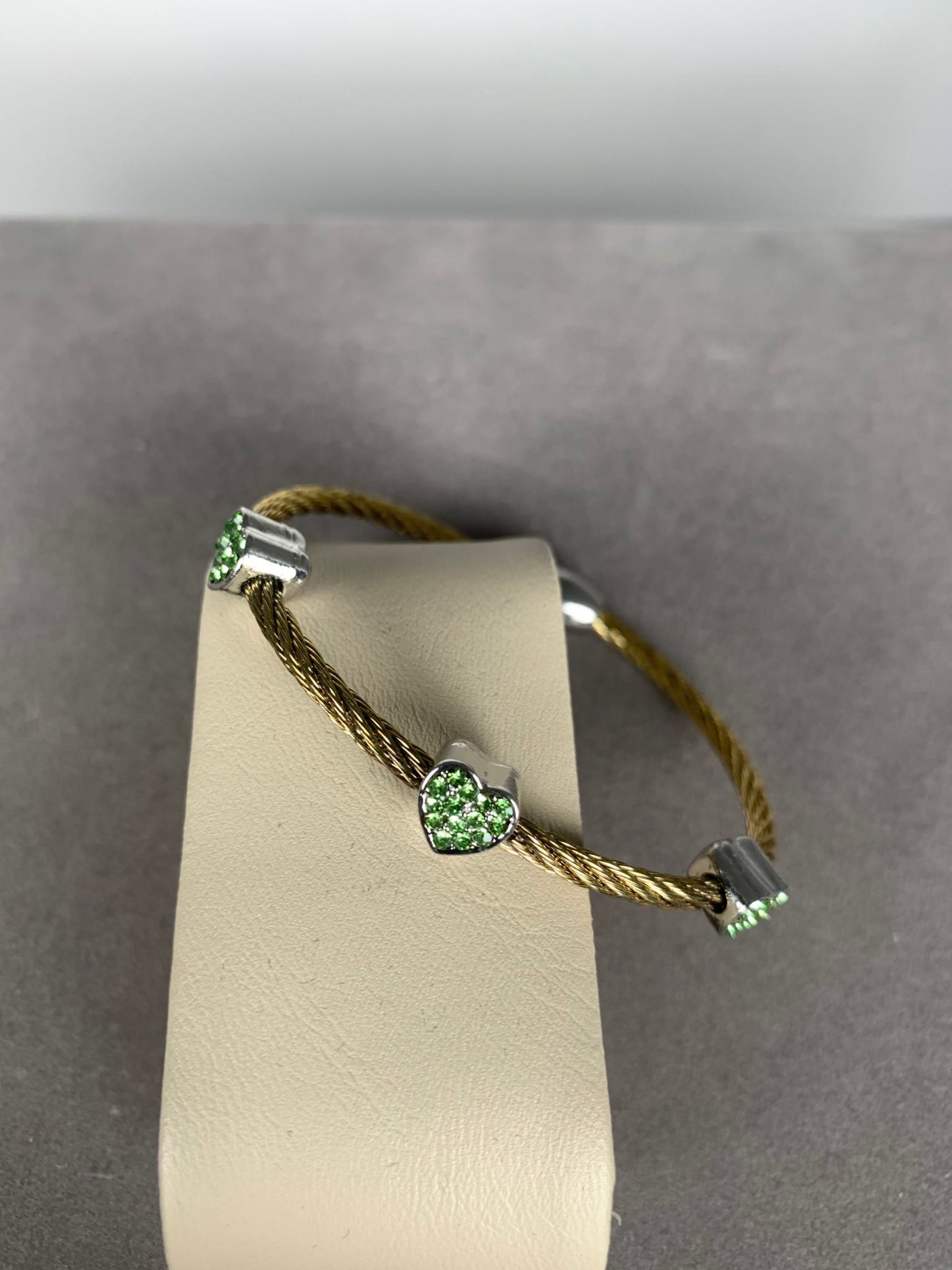 Yellow Gold Tone Wire Bangle Bracelet with 3 Green Crystal Heart Motifs