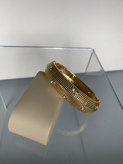 Oval Bangle Decorated with Scattered Crystals in Gold Tone