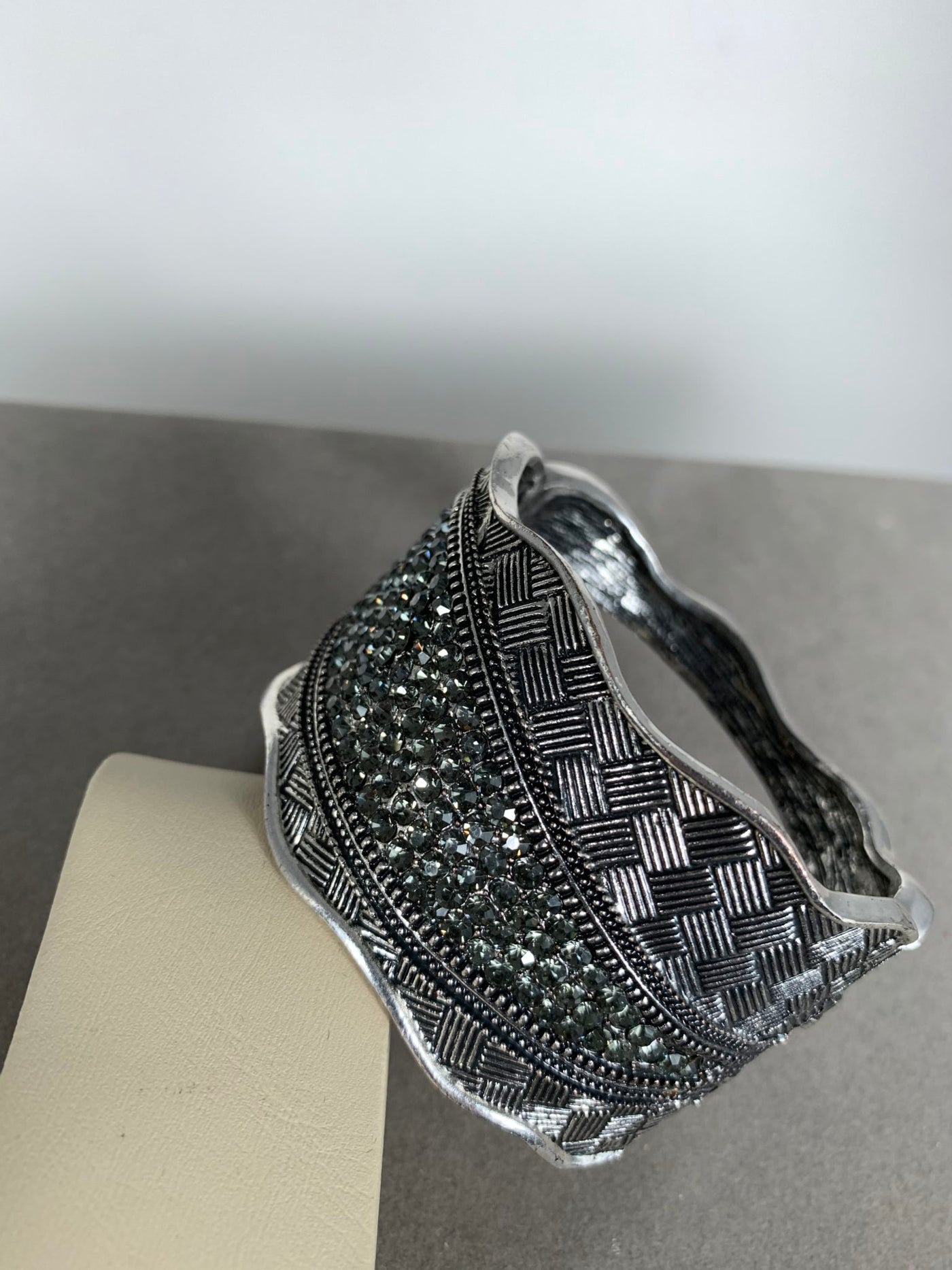 Wide Bangle with Gray Crystal Accent in Silver Tone