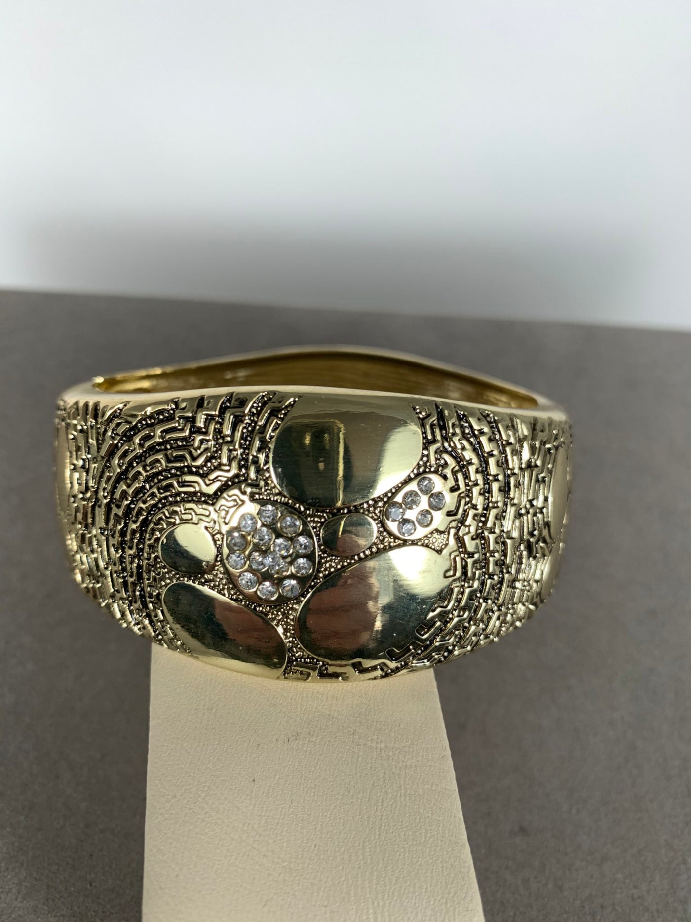 Wide dome shape band bangle with Clear Crystals Accent in Gold Tone