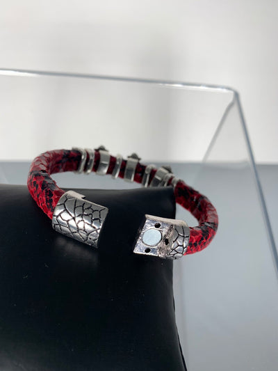 Red Snake Skin Band Bracelet Featuring Fleur De Lis Motifs