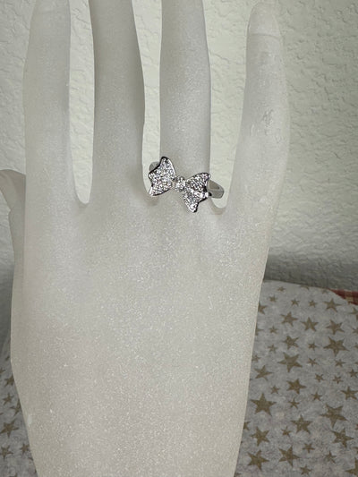 Pave Set Cubic Zirconia Bow Ring in Silver Tone with Sizes